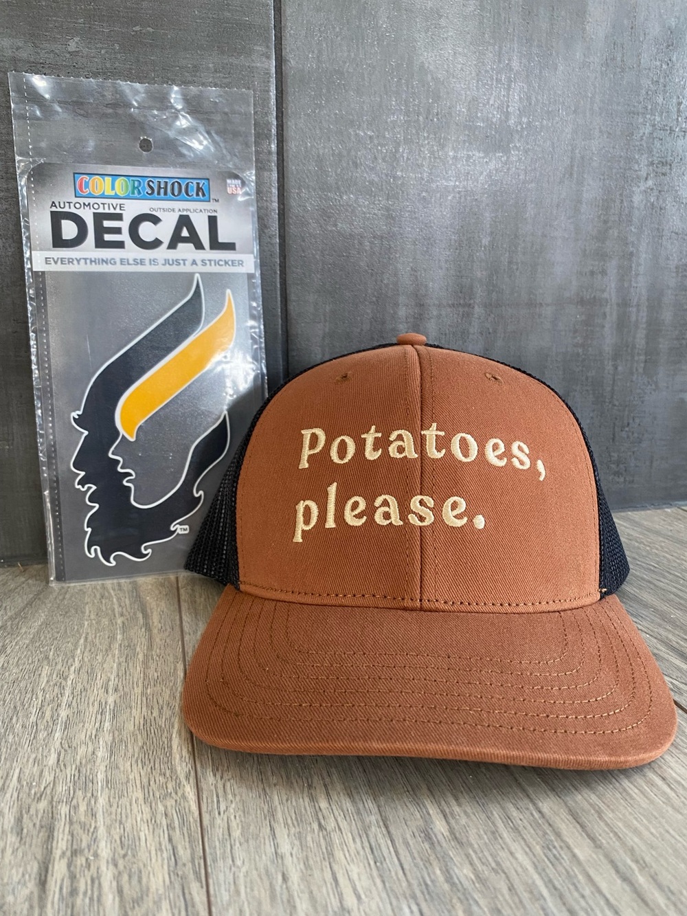 CdA Clothing Company “Potatoes, Please” Caramel/Black Trucker Hat + Bonus